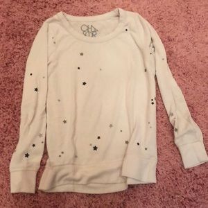 Light pink chaser shirt with small glitter stars.